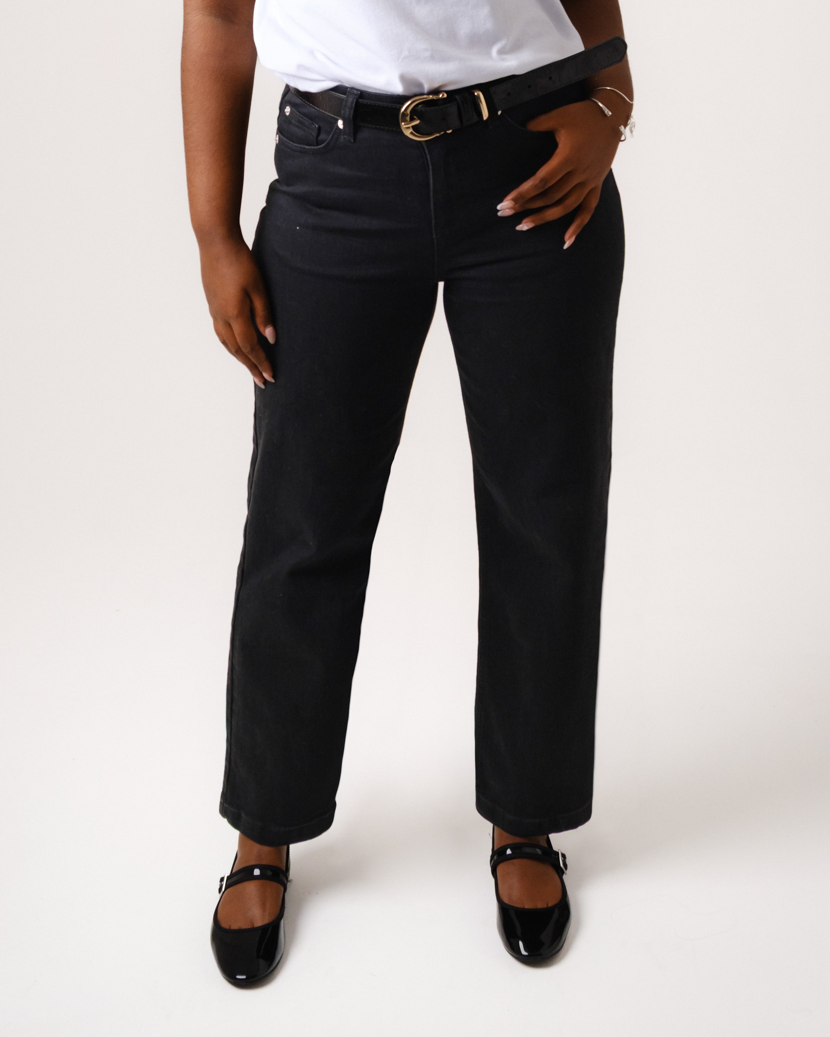 a woman wearing black pants