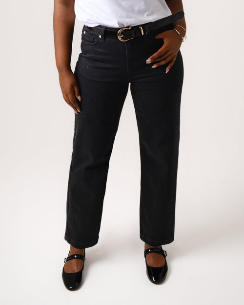 a woman wearing black pants