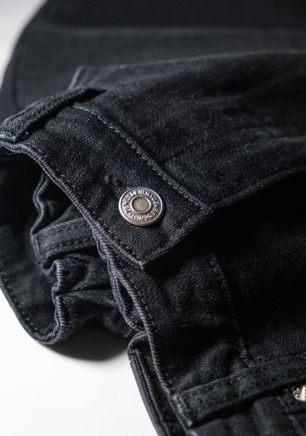 a close up of a black jeans
