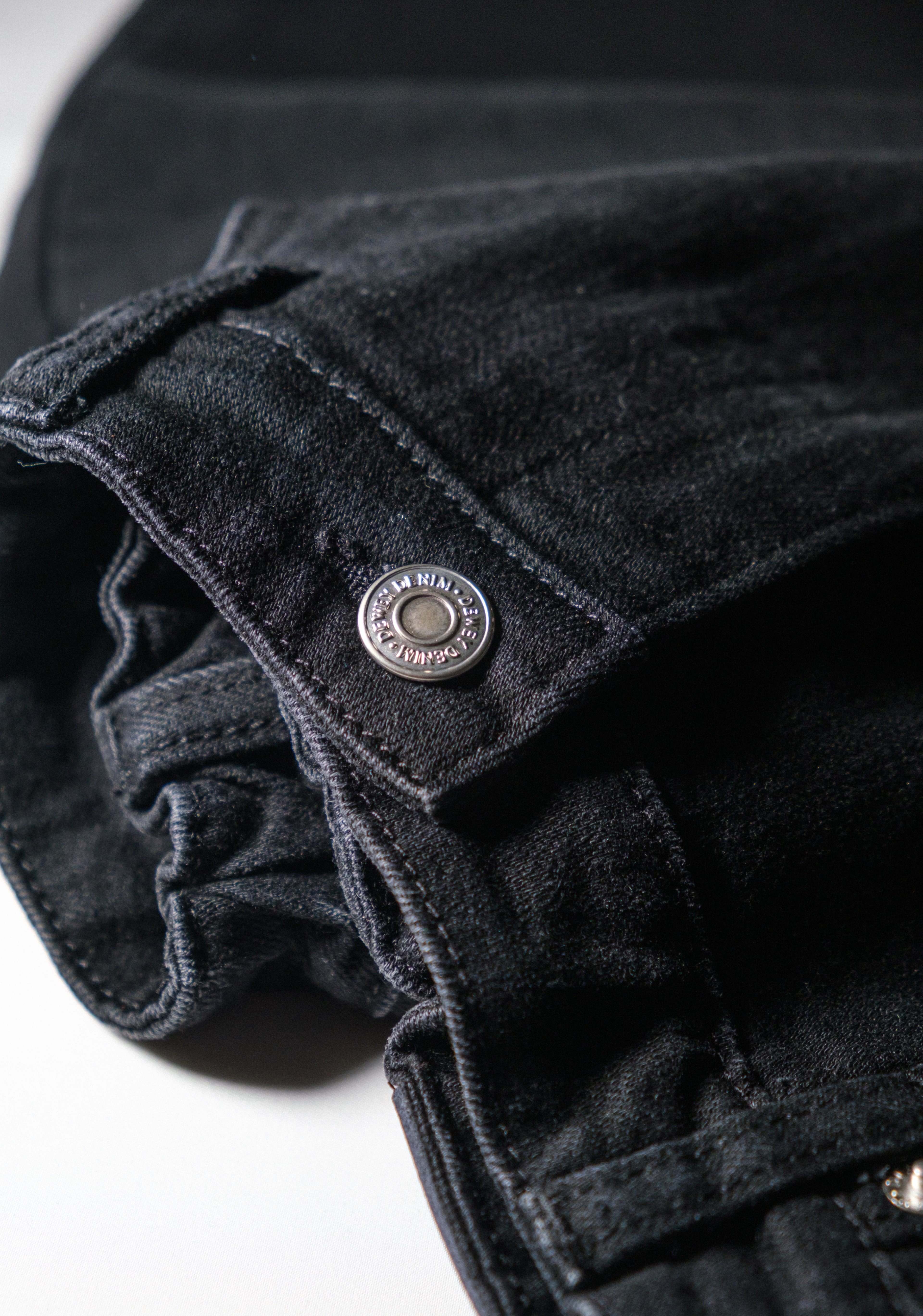 a close up of a black jeans