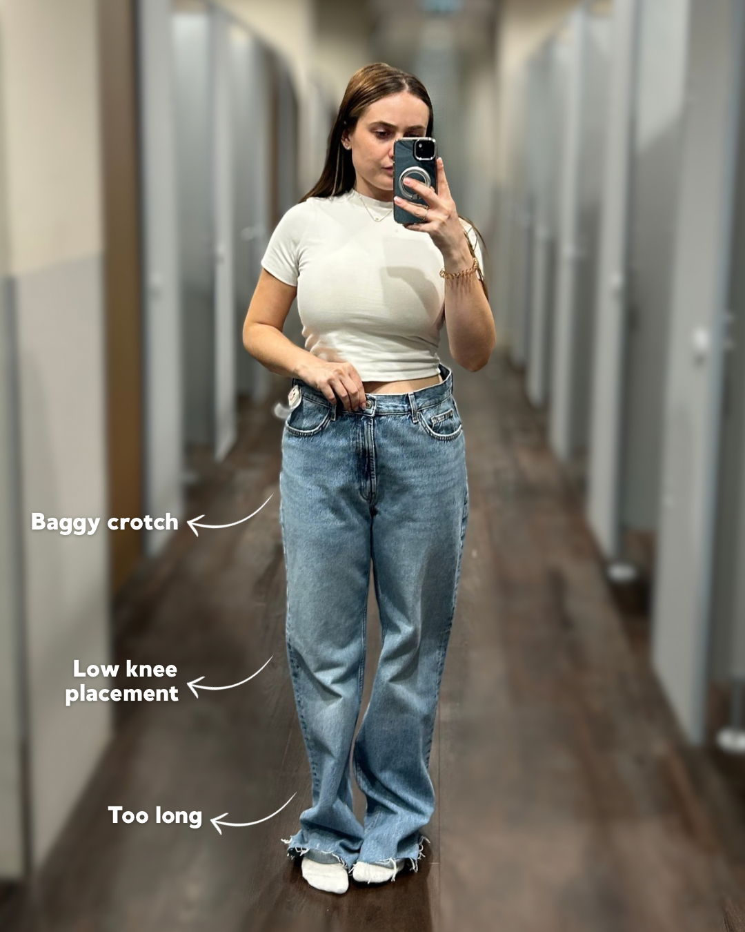 a woman taking a selfie in a mirror