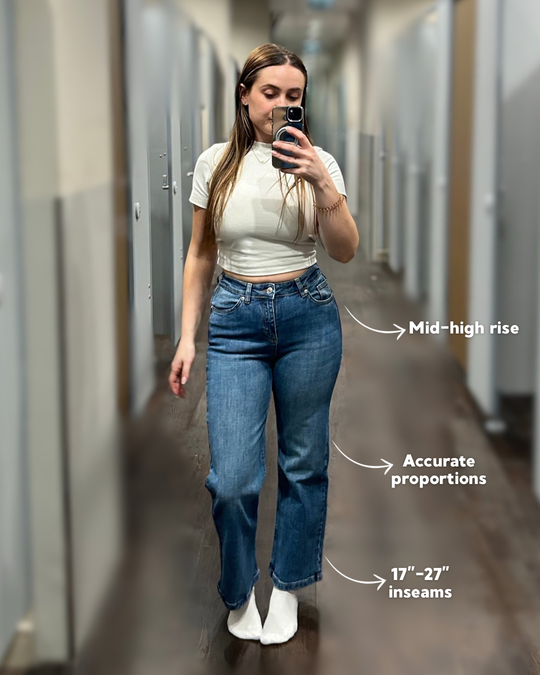 a woman taking a selfie in a mirror