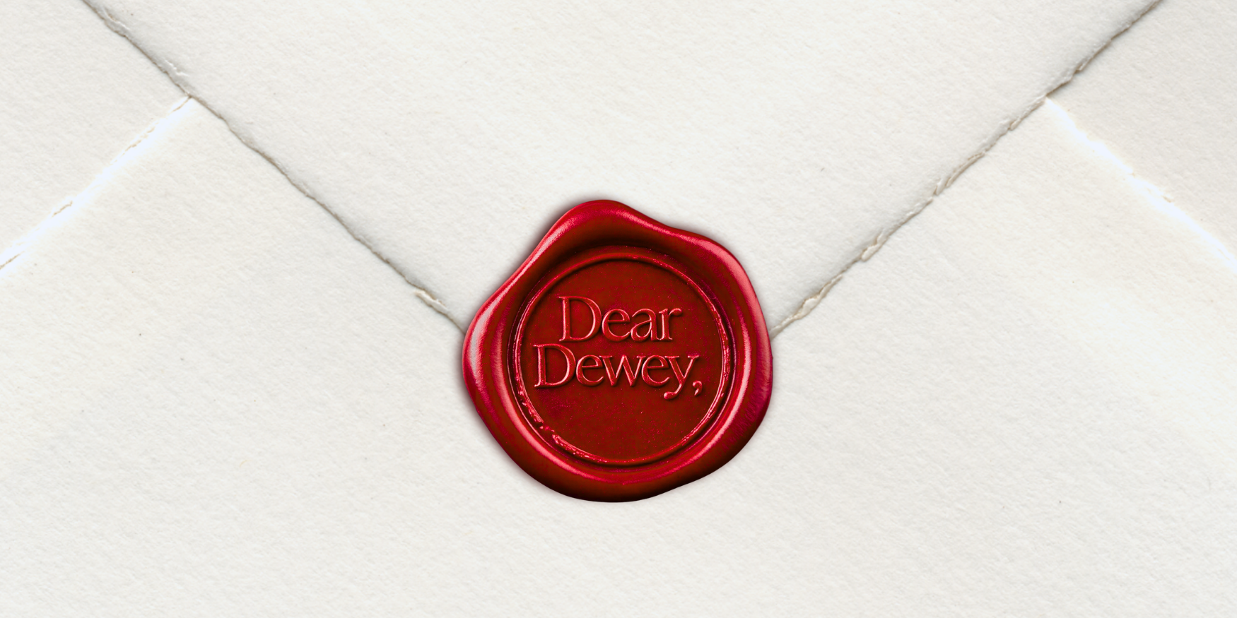 a red wax seal on a white envelope